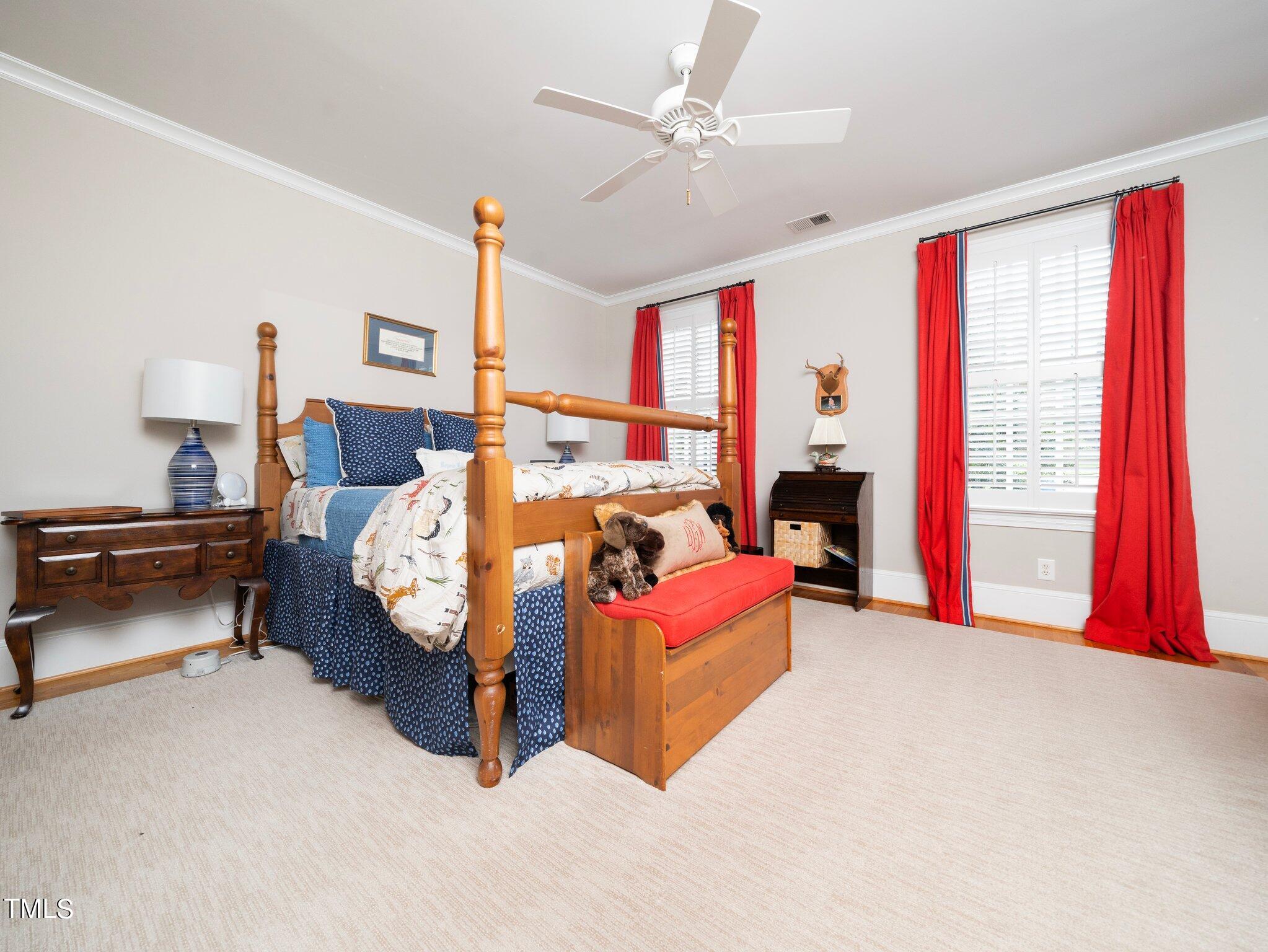 2512 Lewiswood Lane Raleigh, NC 27608 - Photo 26 of 41 a bed room with a bed and a couch