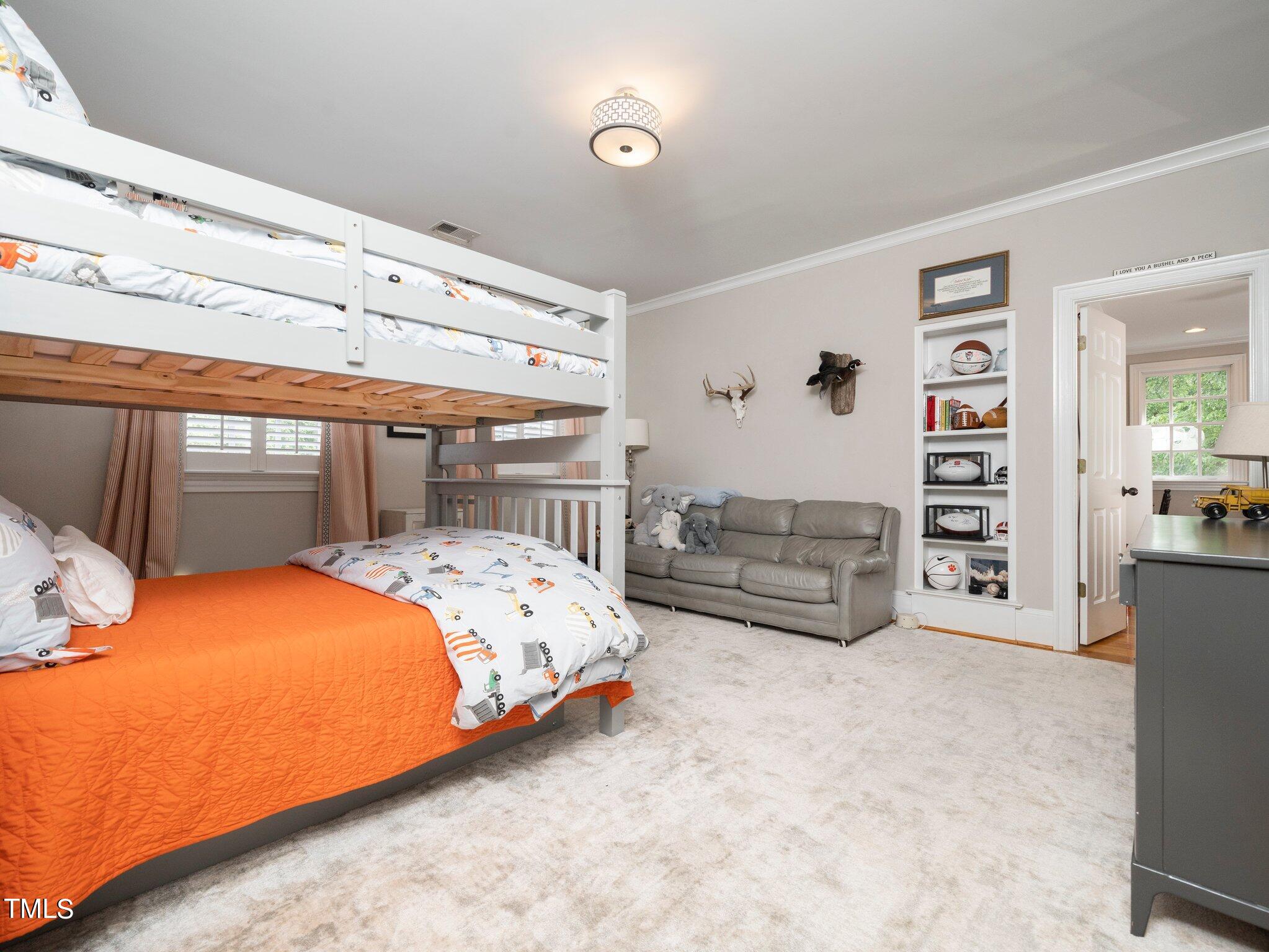 2512 Lewiswood Lane Raleigh, NC 27608 - Photo 27 of 41 a bedroom with a bed and furniture