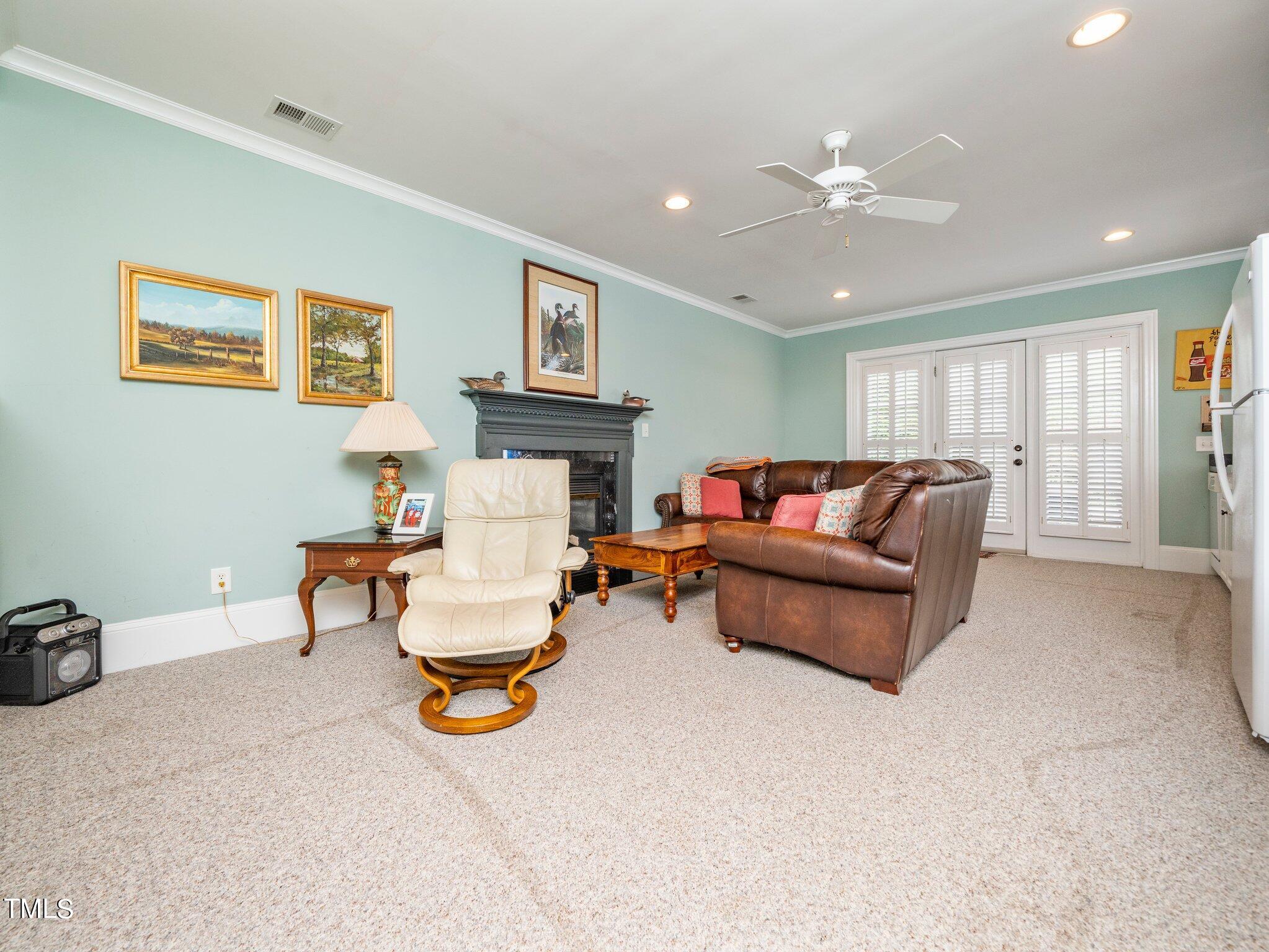 2512 Lewiswood Lane Raleigh, NC 27608 - Photo 30 of 41 a living room with furniture and a chandelier