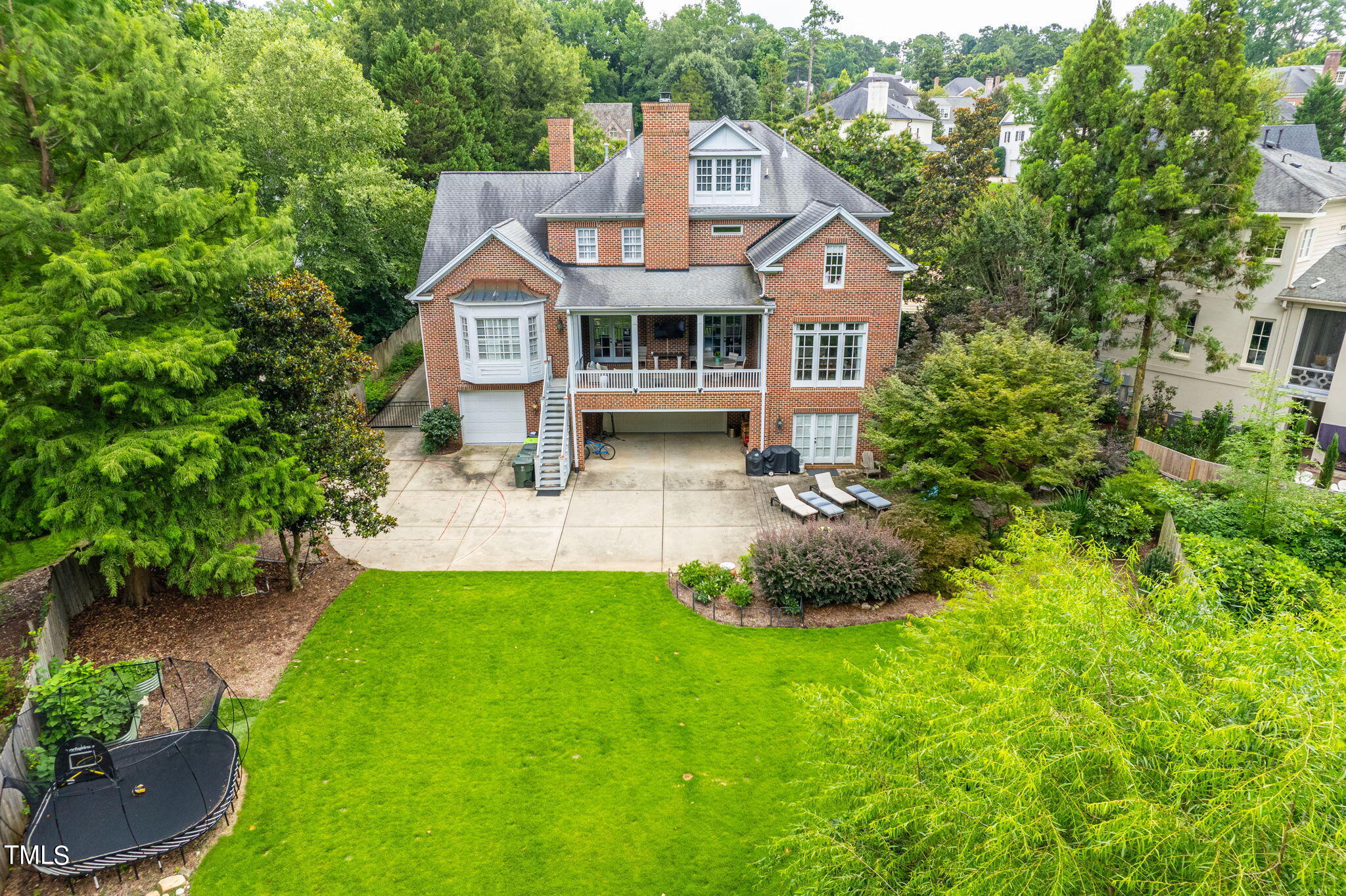 2512 Lewiswood Lane Raleigh, NC 27608 - Photo 3 of 41 a front view of a house with a garden and yard