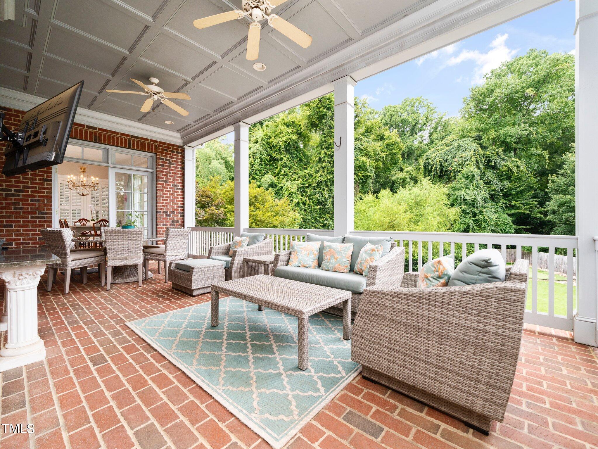 2512 Lewiswood Lane Raleigh, NC 27608 - Photo 32 of 41 a outdoor space with patio the couches and a dining table with garden view