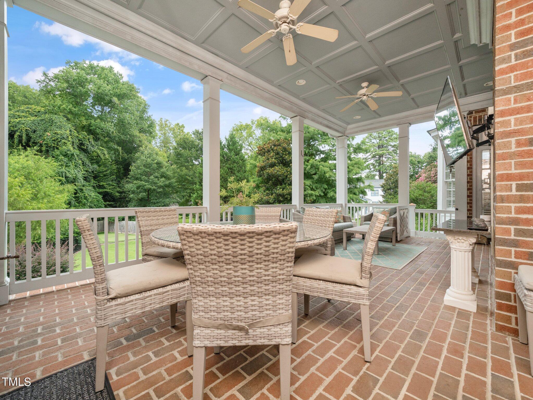 2512 Lewiswood Lane Raleigh, NC 27608 - Photo 33 of 41 a outdoor space with patio the couches and a dining table with garden view
