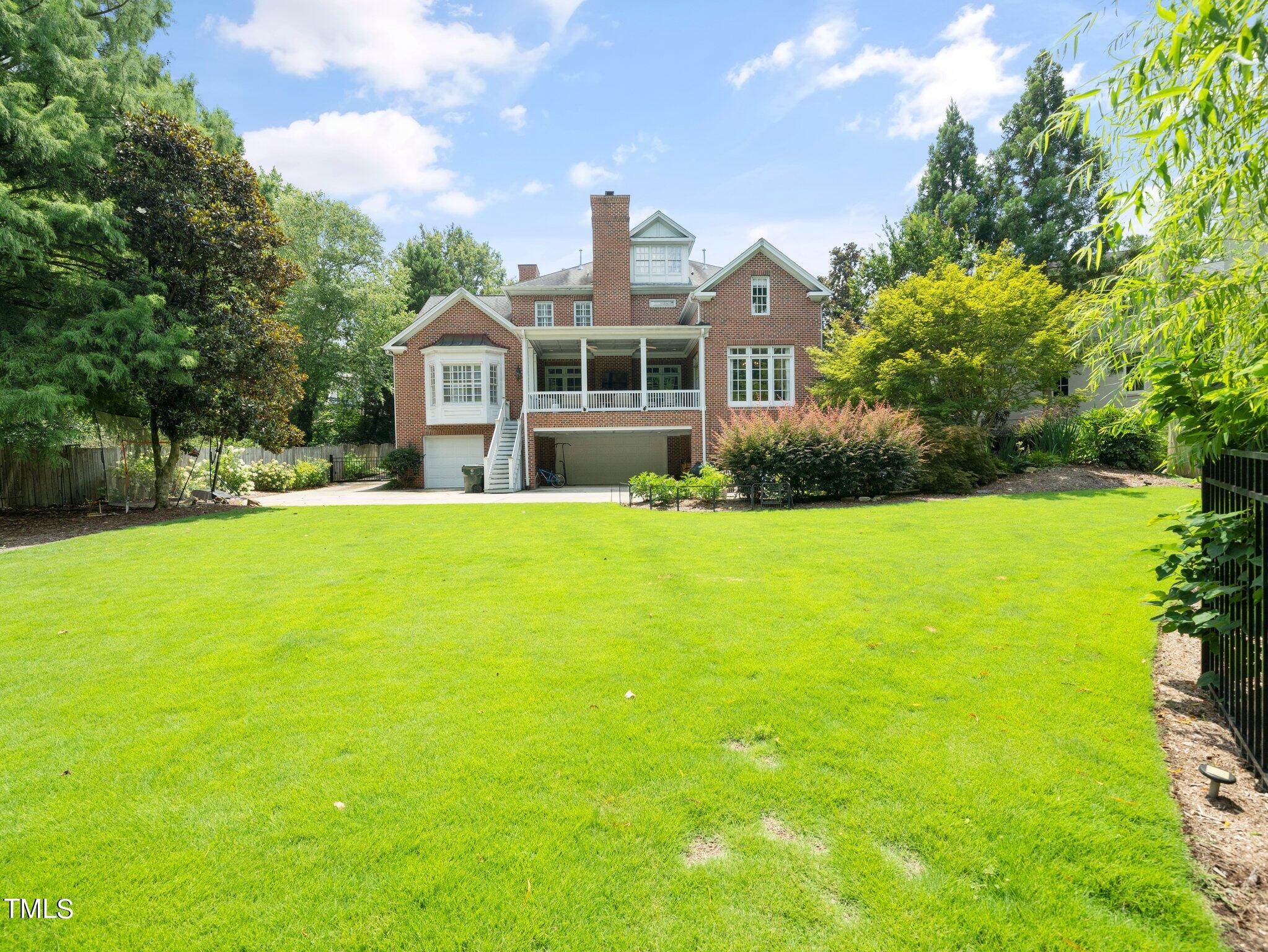 2512 Lewiswood Lane Raleigh, NC 27608 - Photo 38 of 41 a front view of a house with yard and green space