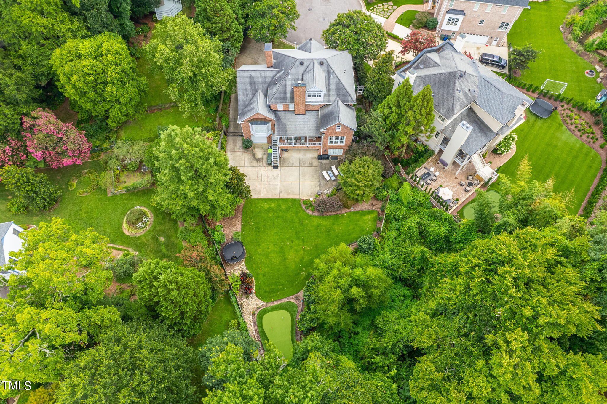 2512 Lewiswood Lane Raleigh, NC 27608 - Photo 39 of 41 an aerial view of a house with lots of green space and garden