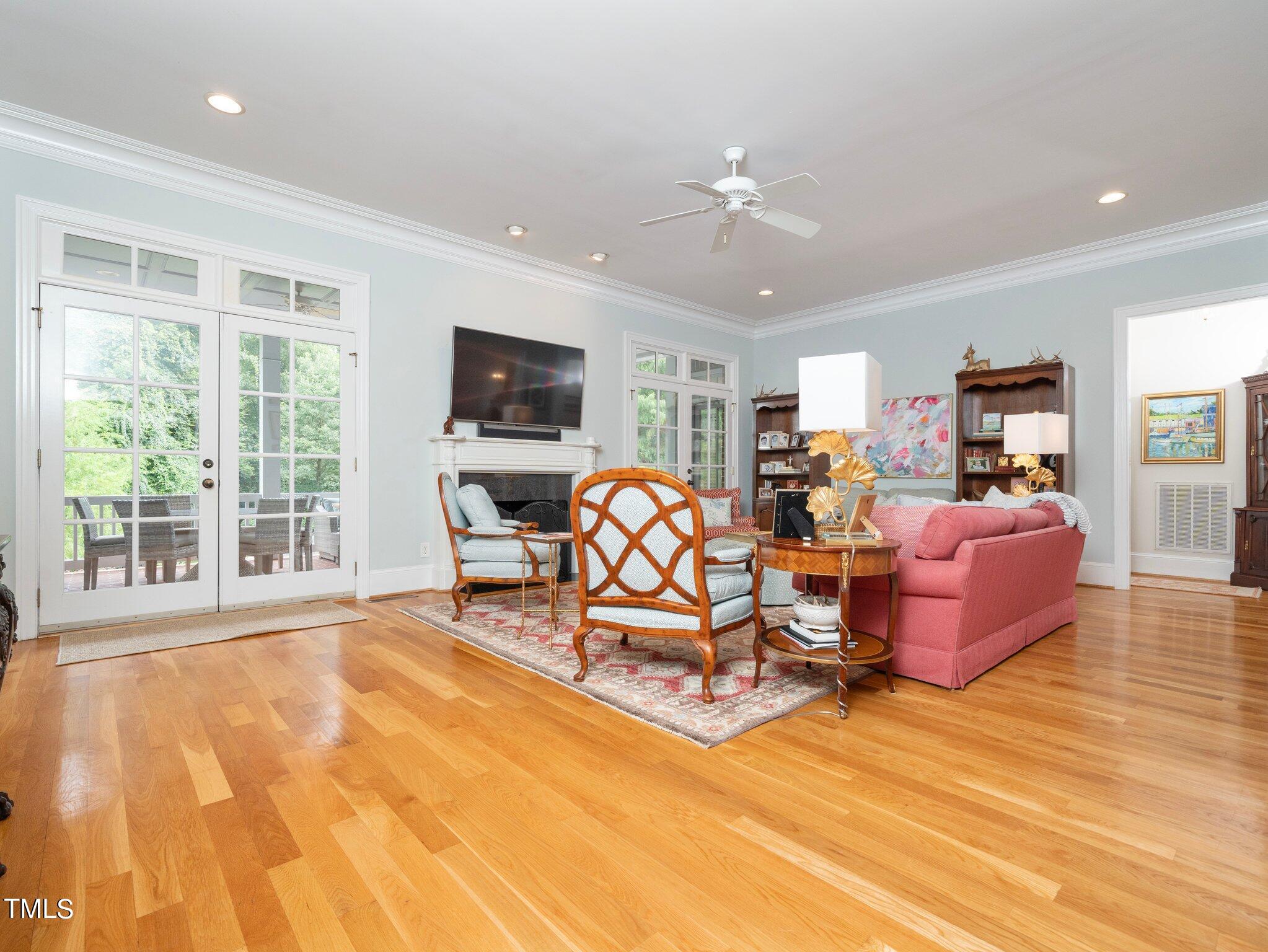 2512 Lewiswood Lane Raleigh, NC 27608 - Photo 5 of 41 a living room with furniture large window and flat screen tv