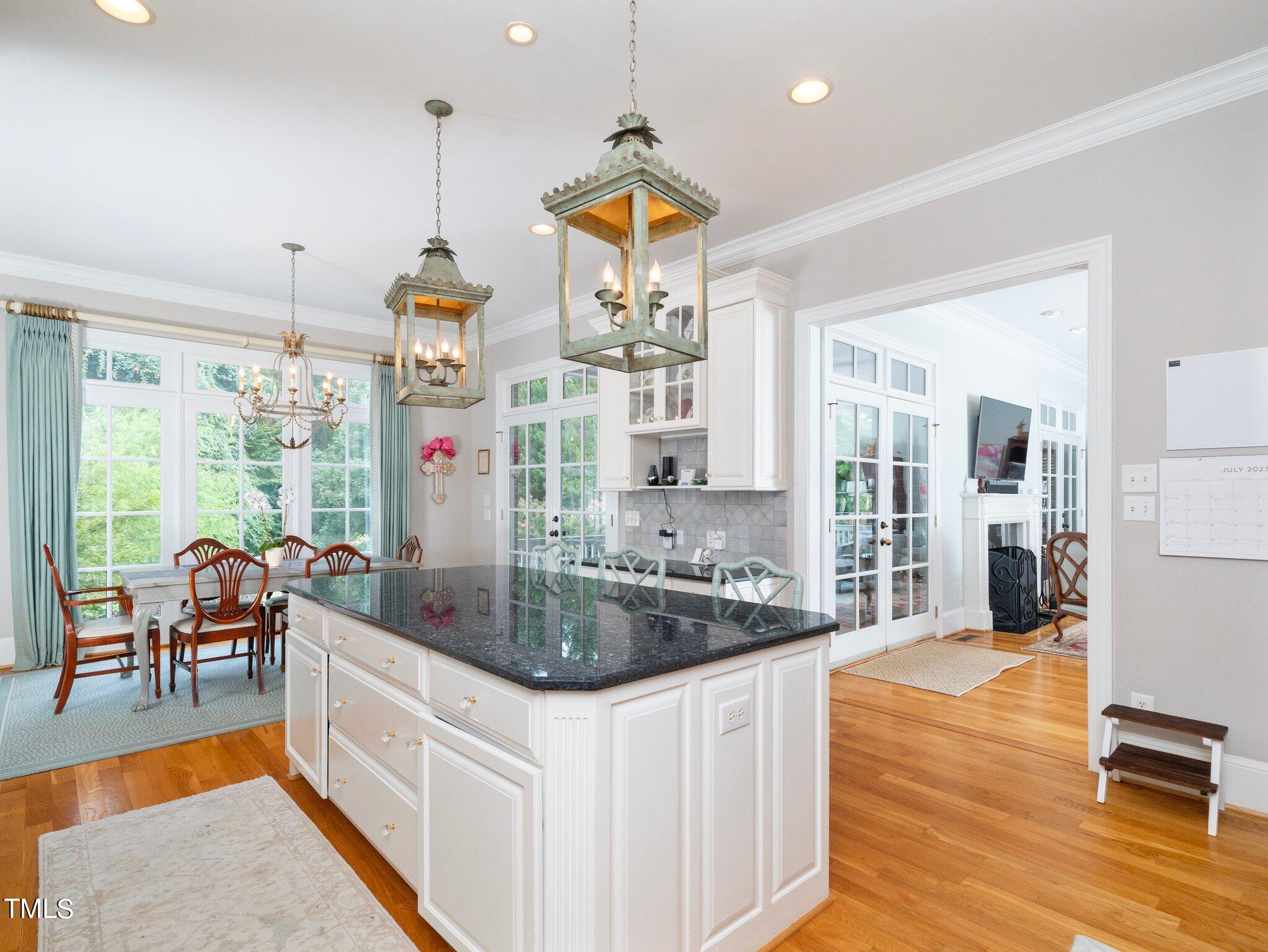 2512 Lewiswood Lane Raleigh, NC 27608 - Photo 7 of 41 a kitchen with stainless steel appliances granite countertop a stove and a view of living room