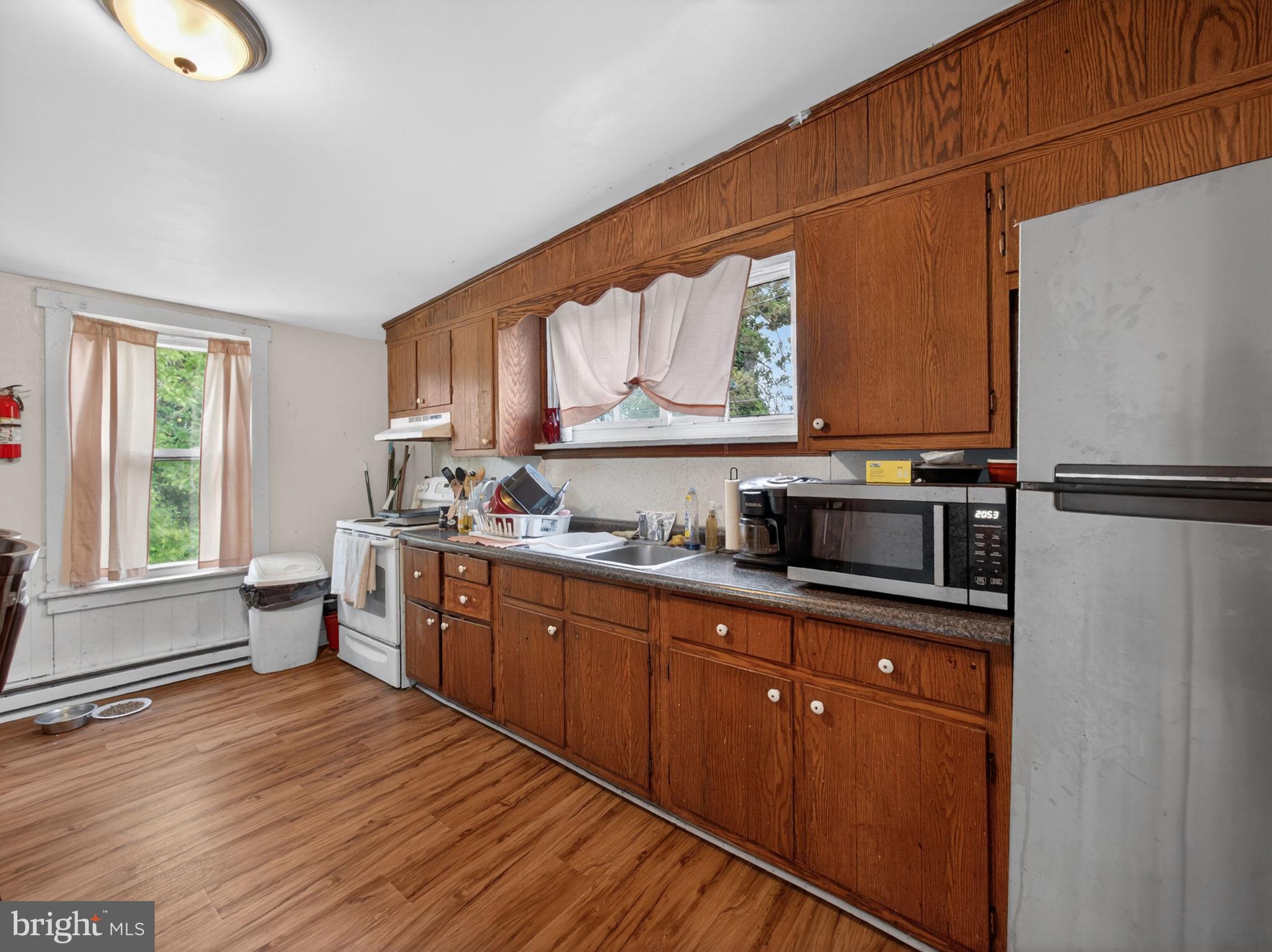866 East High Street Pottstown, PA 19464 - Photo 34 of 45 Cozy kitchen with warm wooden tones.