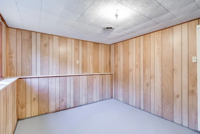 a view of a room with pool table and chairs