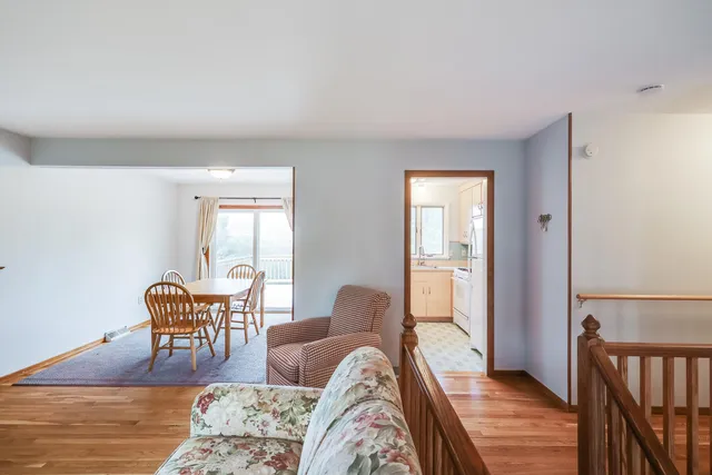 a front view of a house with a yard and a garage