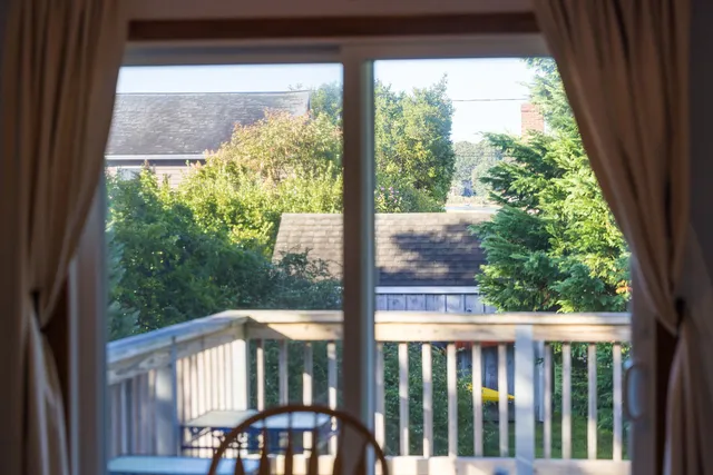 a view of a house with backyard porch and sitting area