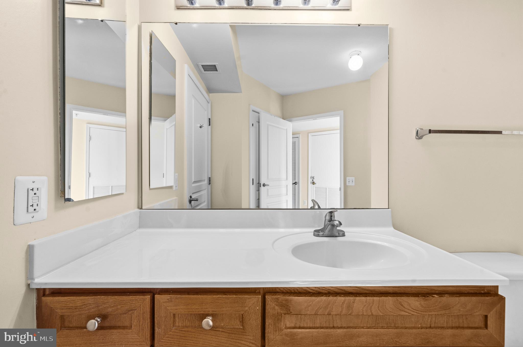 631 D Street Northwest, Unit 733 Washington, DC 20004 - Photo 27 of 100 a bathroom with a sink and a mirror