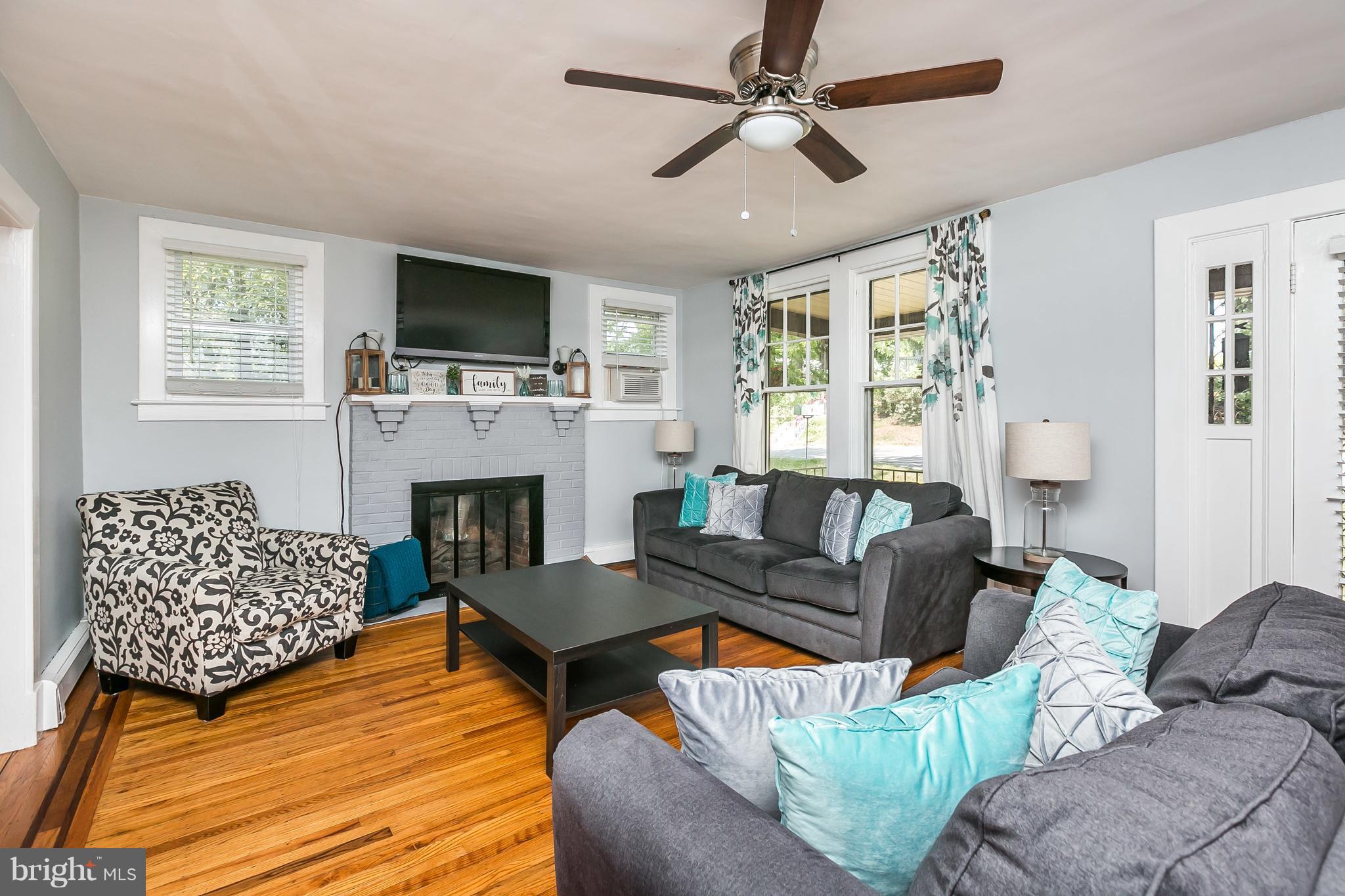 801 Woodsdale Road Baltimore, MD 21228 - Photo 3 of 29 Living Room has ceiling fan for year round comfort