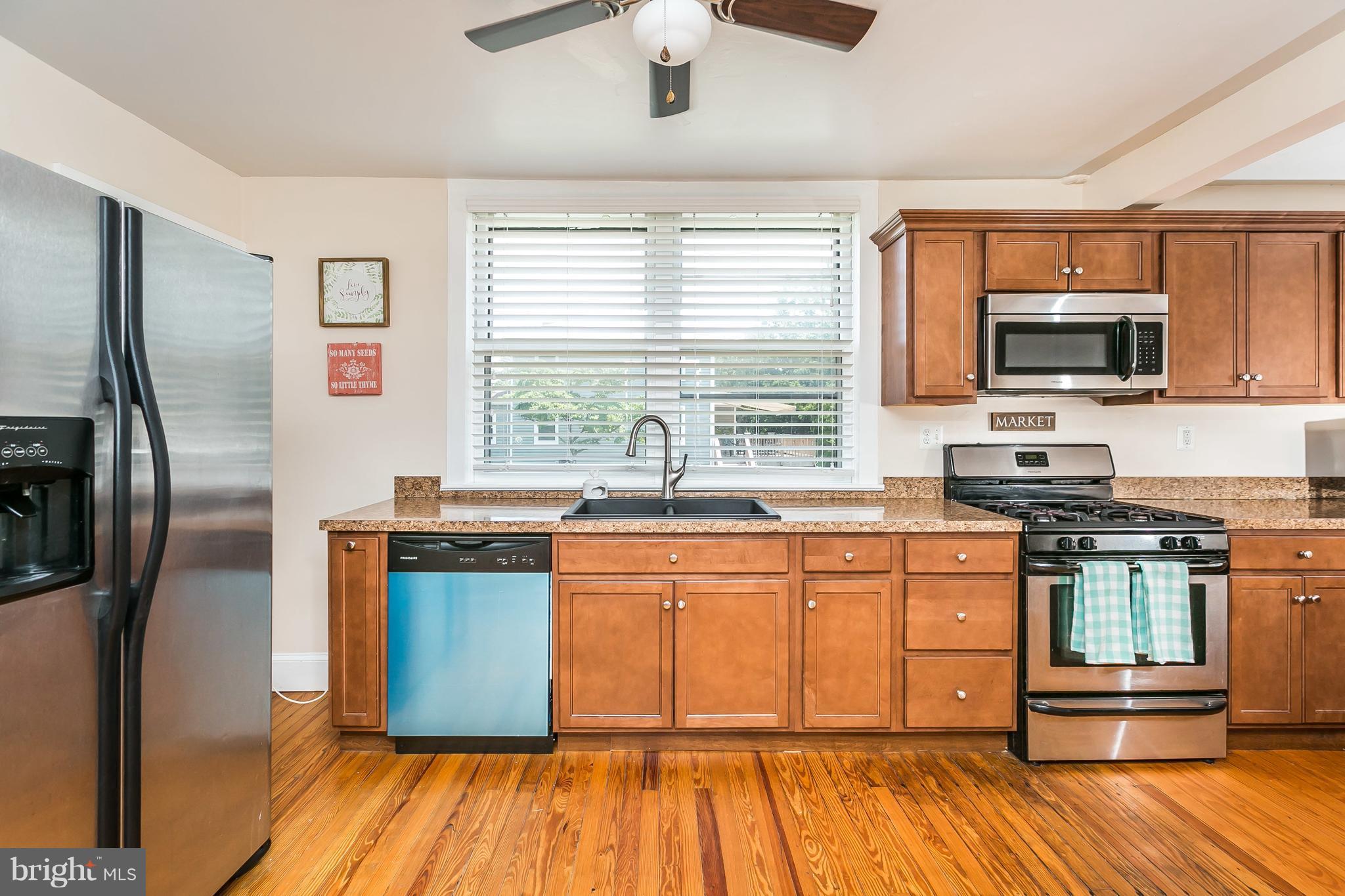 801 Woodsdale Road Baltimore, MD 21228 - Photo 9 of 29 Remodeled Kitchen w/stainless appliances