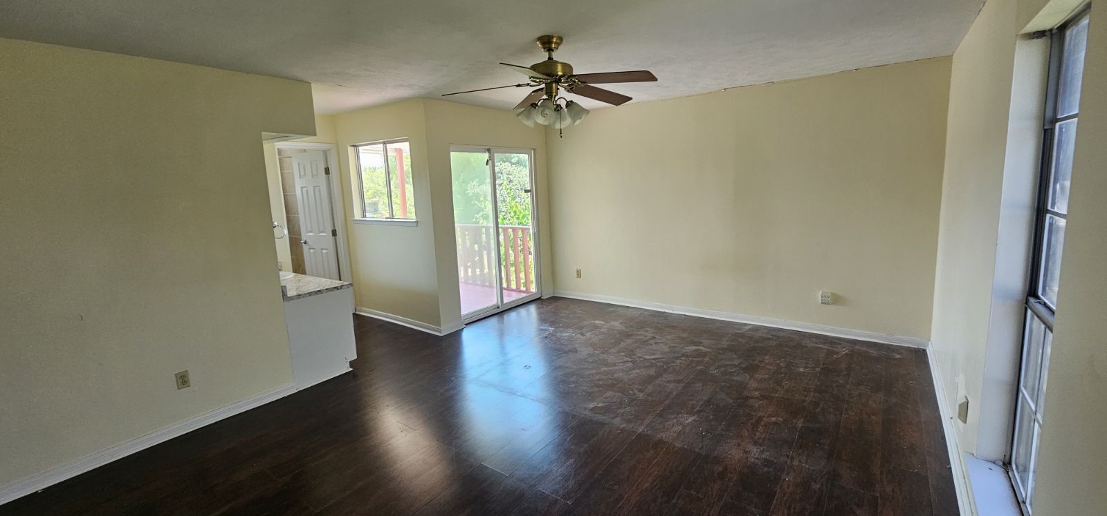 5002 Ripple Creek Drive Baytown, TX 77521 - Photo 3 of 11 wooden floor in an empty room with a window