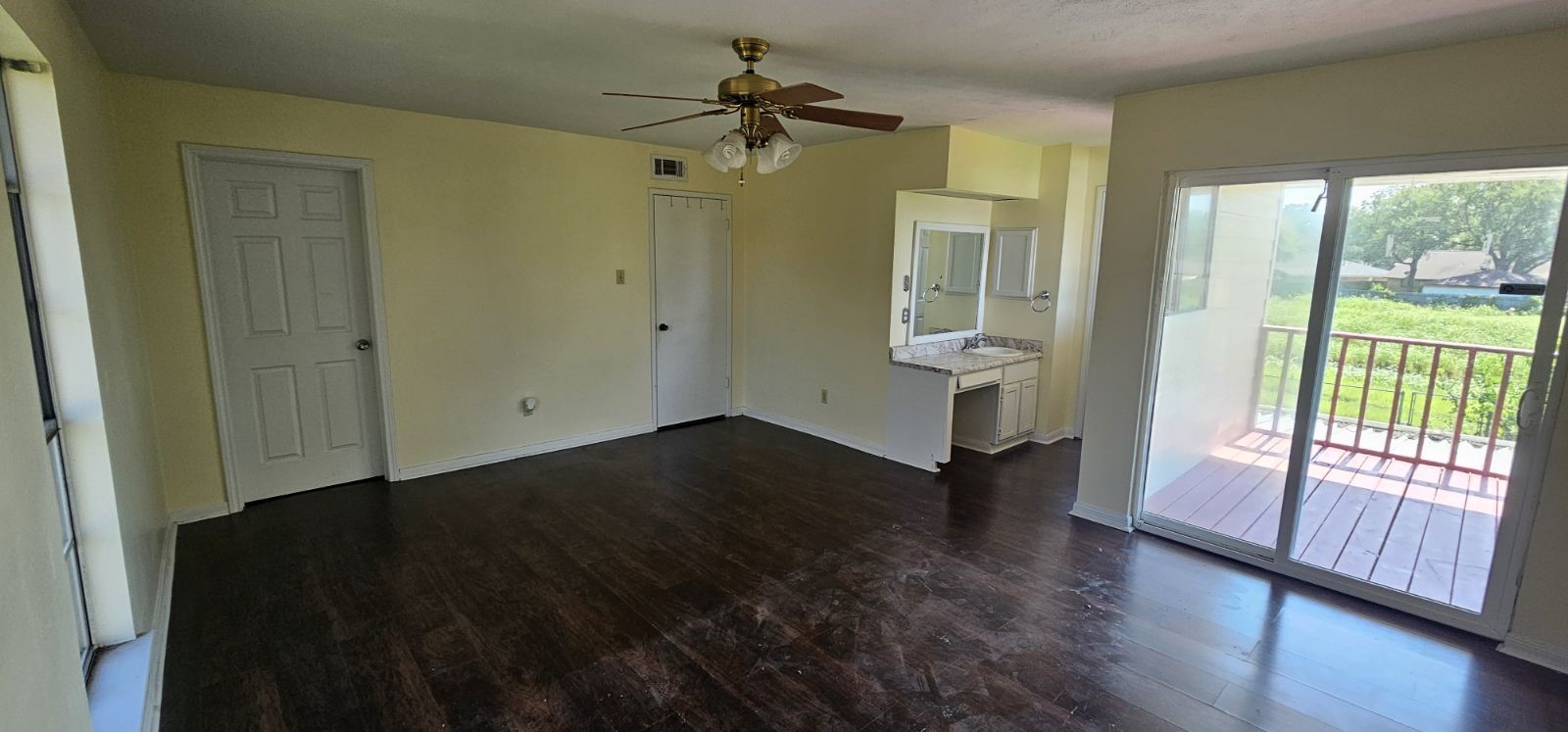 5002 Ripple Creek Drive Baytown, TX 77521 - Photo 4 of 11 a view of empty room with wooden floor and fan