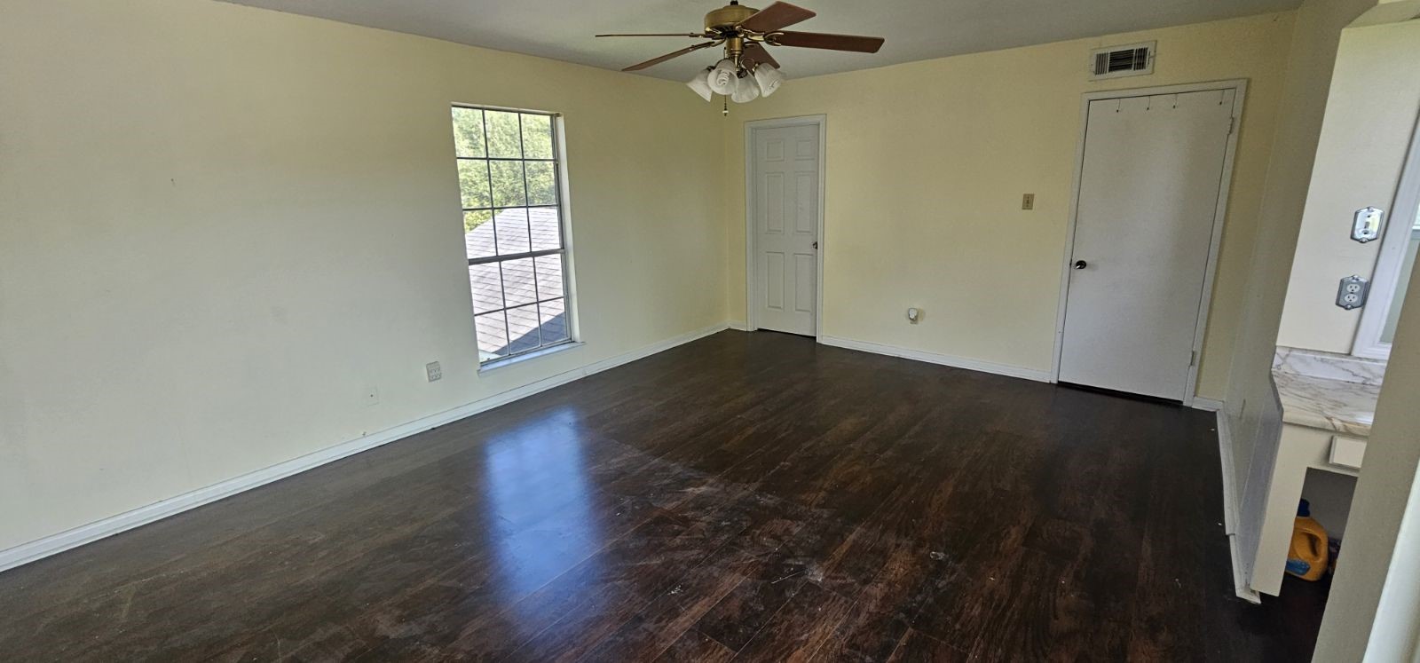 5002 Ripple Creek Drive Baytown, TX 77521 - Photo 5 of 11 wooden floor in an empty room with a window