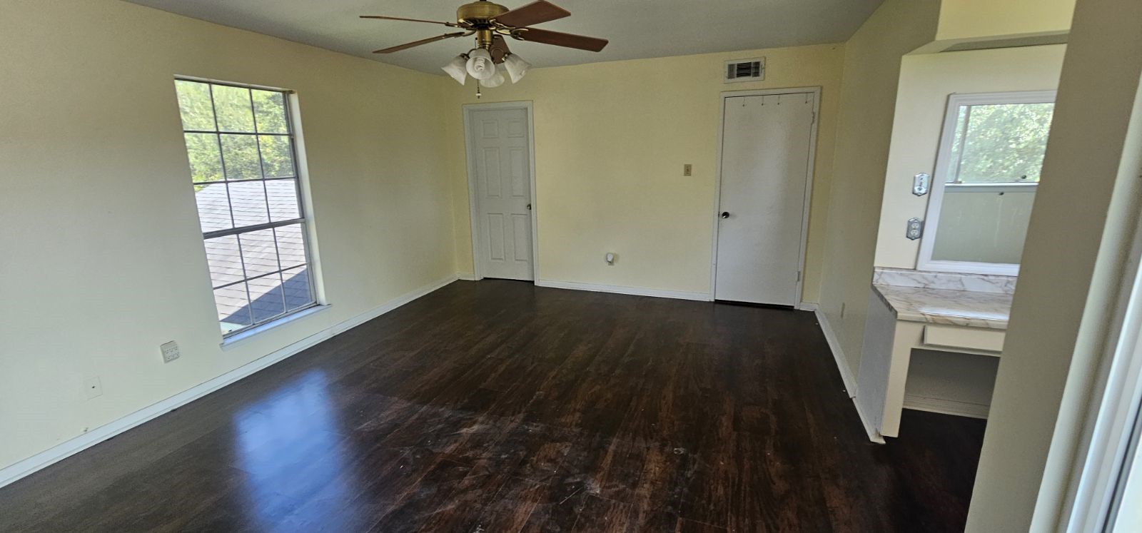 5002 Ripple Creek Drive Baytown, TX 77521 - Photo 6 of 11 wooden floor in an empty room with a window