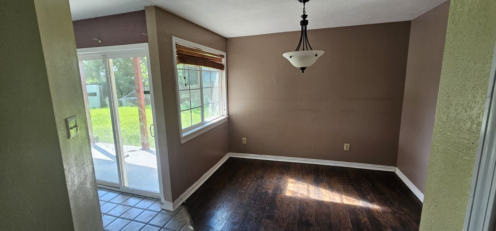 5002 Ripple Creek Drive Baytown, TX 77521 - Photo 7 of 11 a view of empty room with wooden floor and fan
