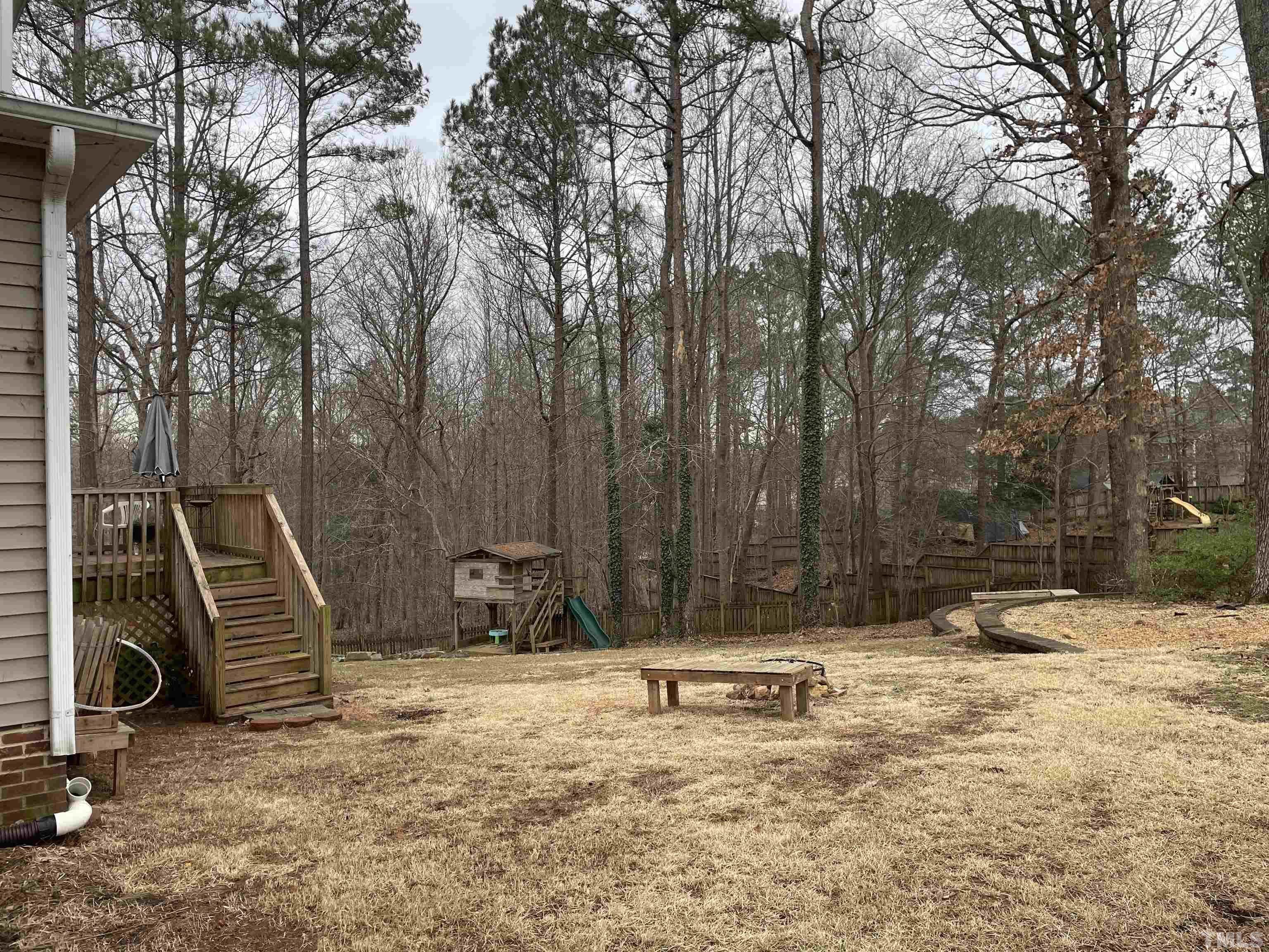 1073 Alderman Circle Raleigh, NC 27603 - Photo 3 of 30 a view of a backyard with a bench
