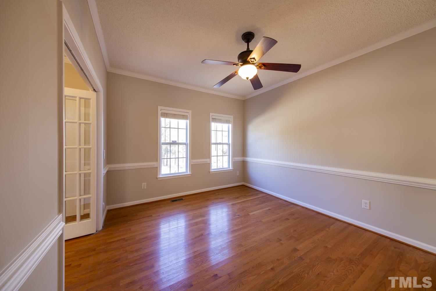 1073 Alderman Circle Raleigh, NC 27603 - Photo 5 of 30 a view of an empty room with wooden floor and a window