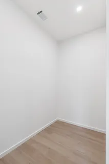 a bathroom with a toilet sink and shower