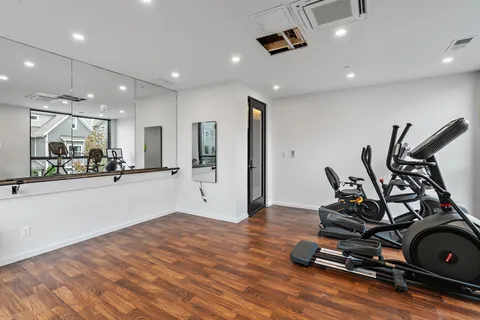 a kitchen with stainless steel appliances a white stove and cabinets
