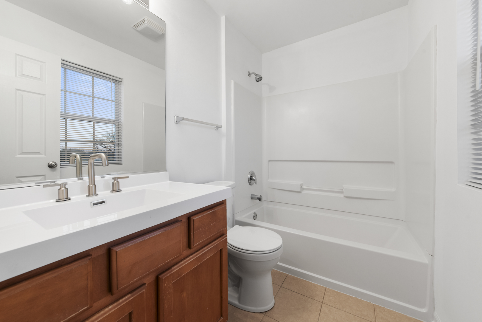3721 Bailey Road Yorkville, IL 60560 - Photo 12 of 18 a bathroom with a sink a toilet and shower