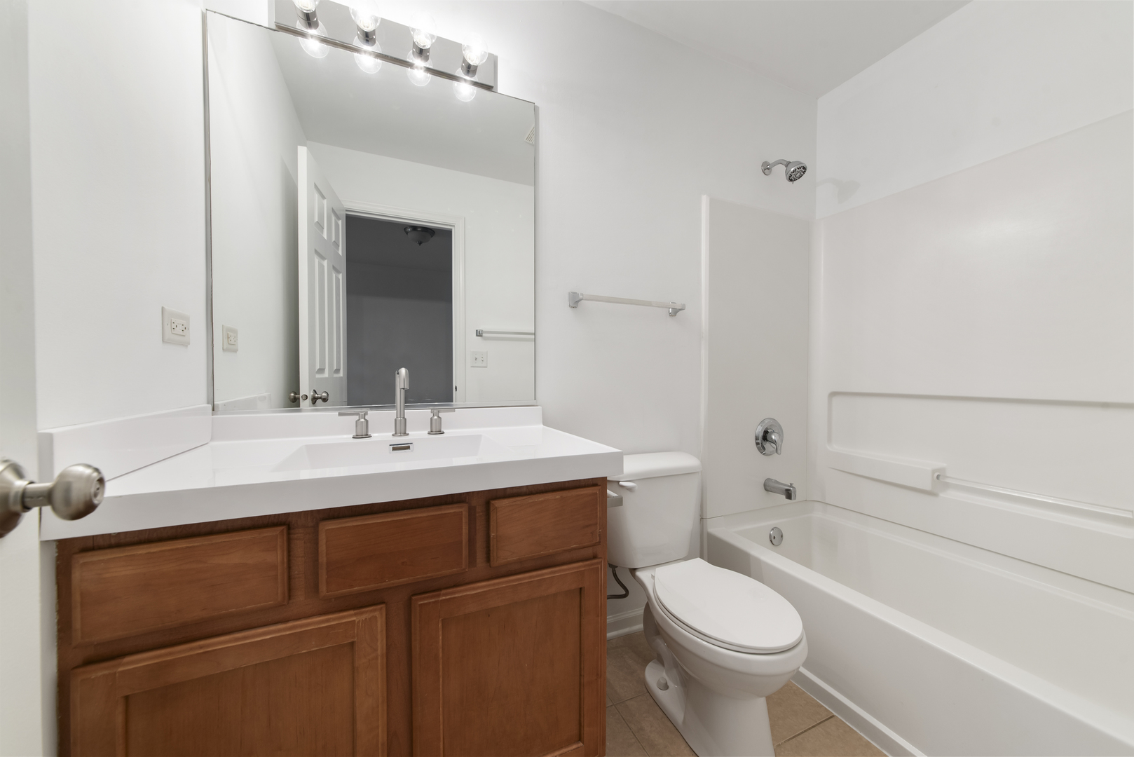 3721 Bailey Road Yorkville, IL 60560 - Photo 13 of 18 a bathroom with a sink toilet vanity and tub