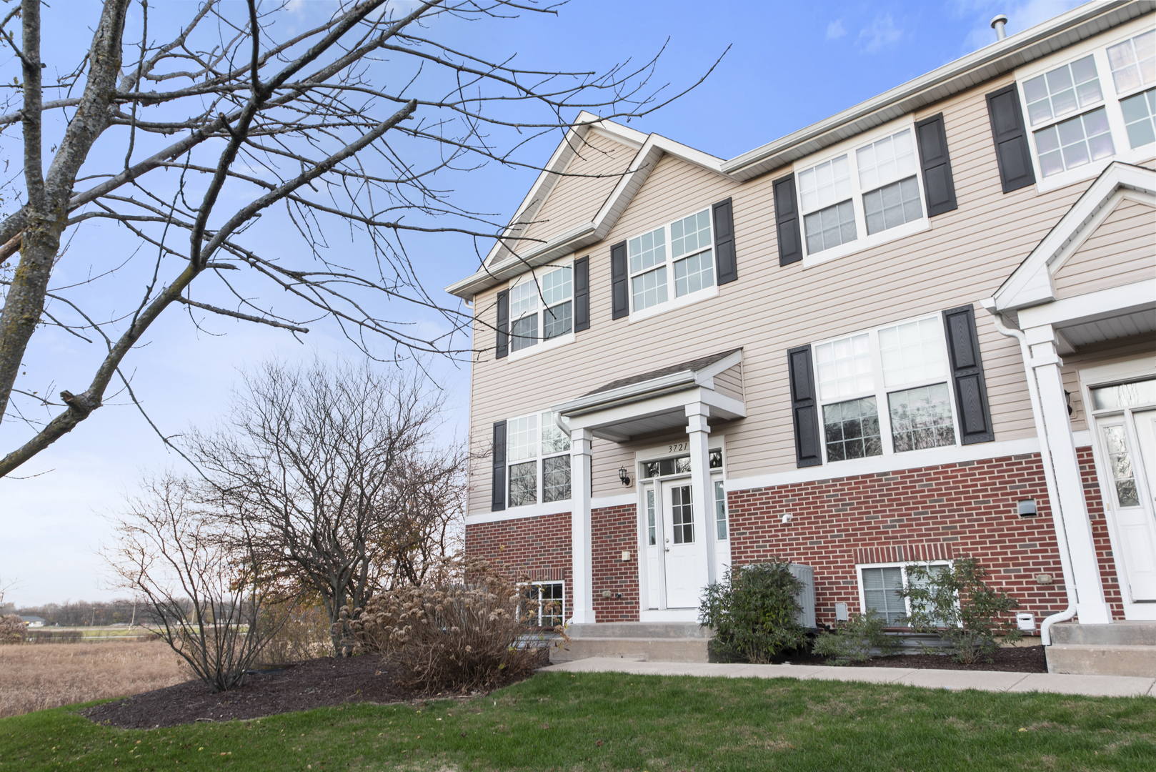 3721 Bailey Road Yorkville, IL 60560 - Photo 2 of 18 view of a building with a yard
