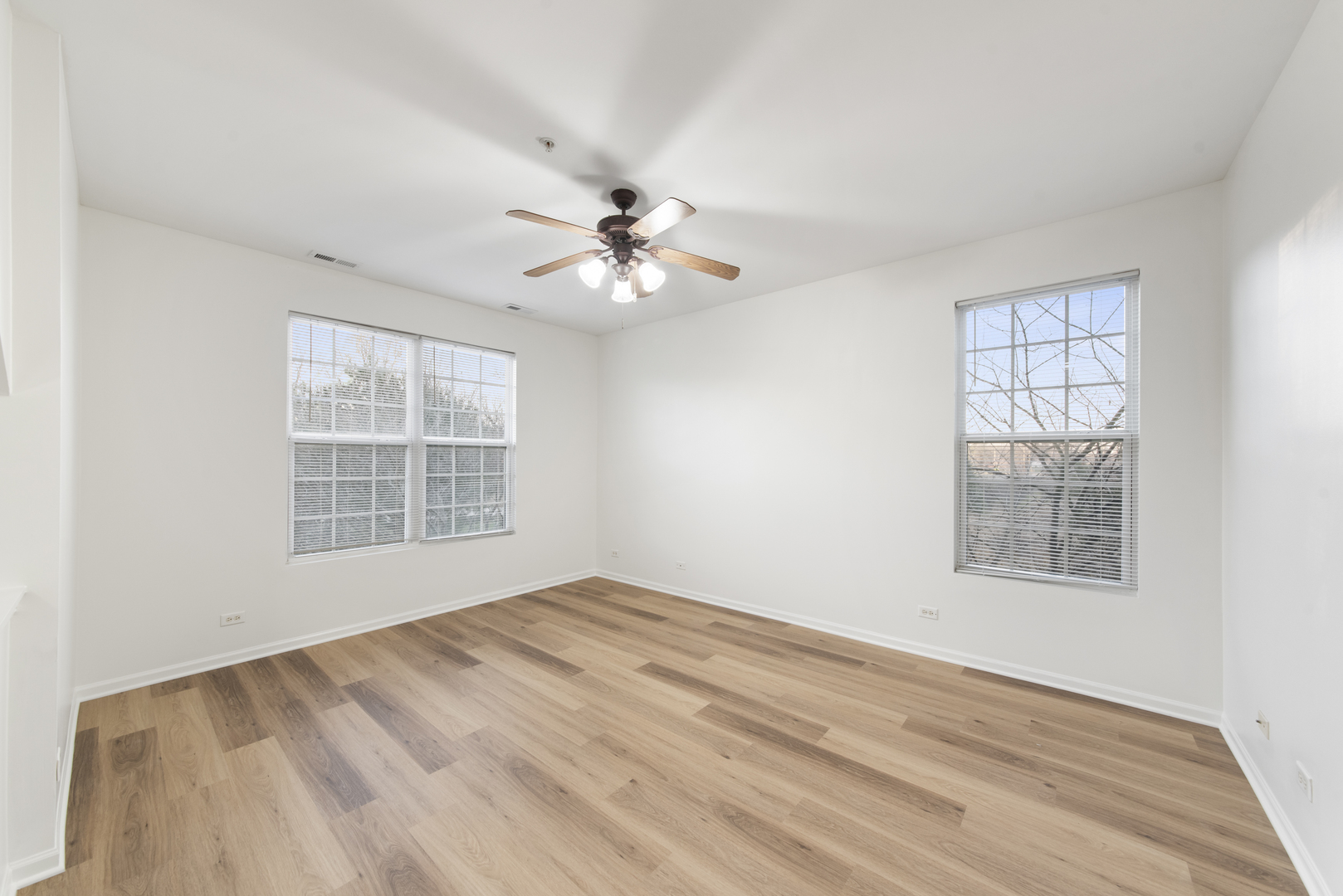 3721 Bailey Road Yorkville, IL 60560 - Photo 7 of 18 a view of an empty room with a window and a chandelier fan