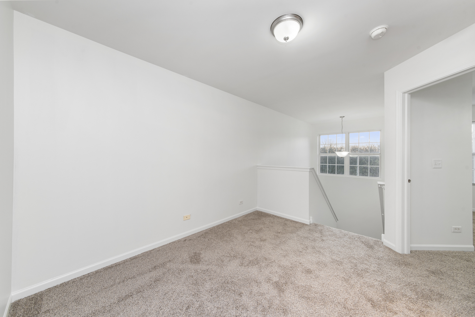 3721 Bailey Road Yorkville, IL 60560 - Photo 9 of 18 an empty room with an empty space and wooden floor
