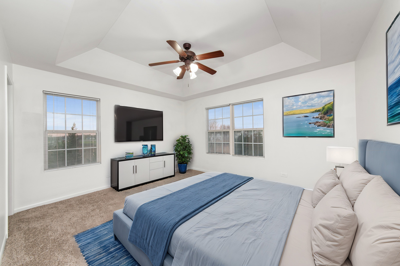 3721 Bailey Road Yorkville, IL 60560 - Photo 10 of 18 a bedroom with a bed a window and a flat screen television