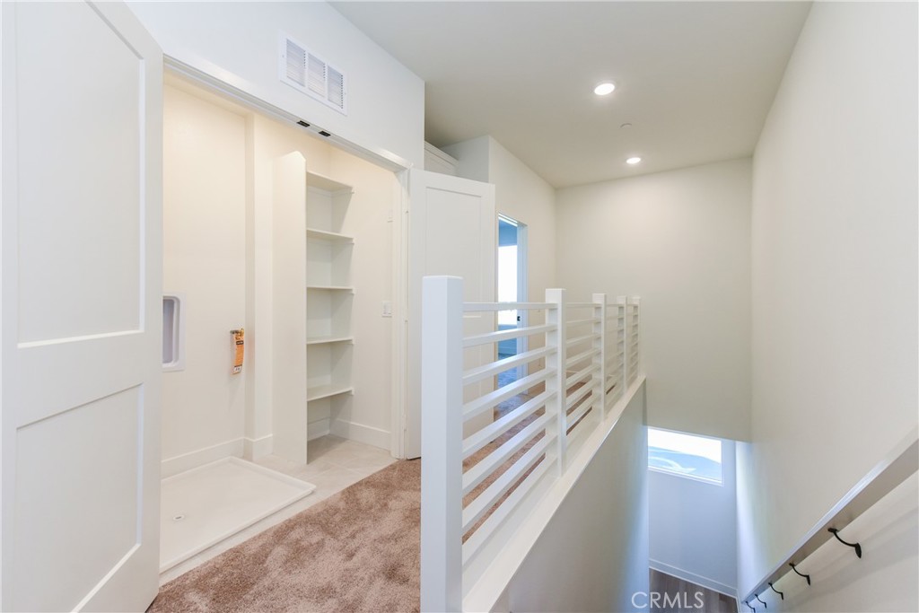 16432 Compass Avenue Tustin, CA 92782 - Photo 21 of 35 a view of entryway with white walls and stairs