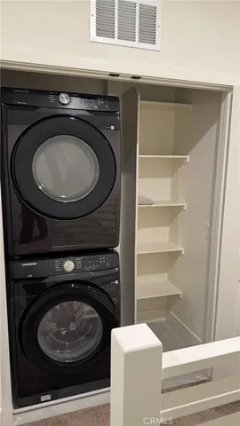 a bathroom with a stove a toilet and a sink