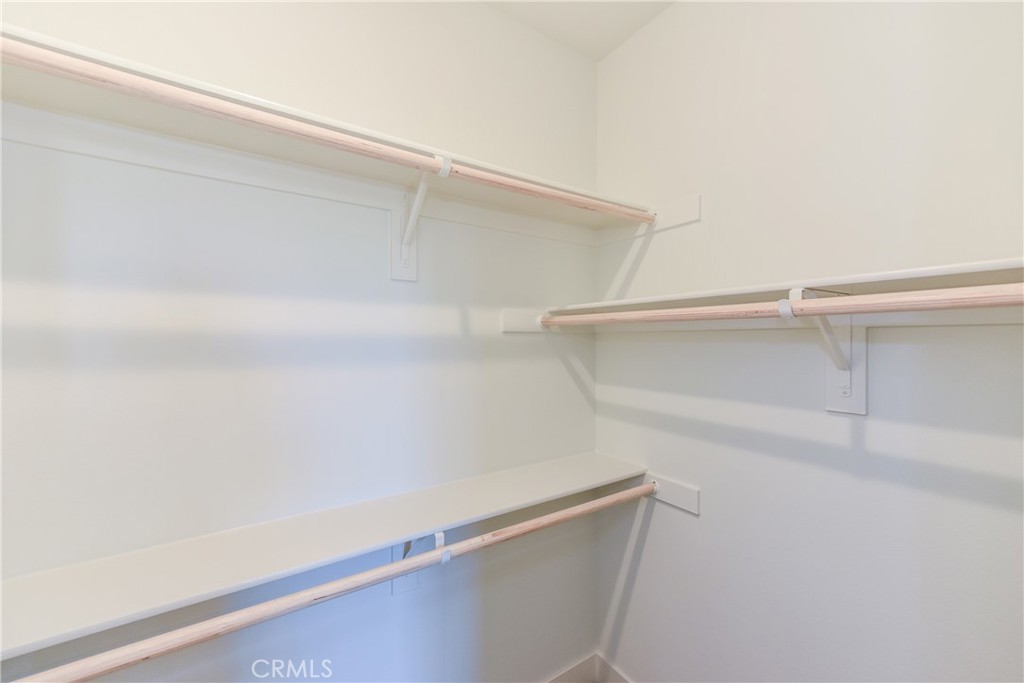 16432 Compass Avenue Tustin, CA 92782 - Photo 31 of 35 a view of an empty walk in closet