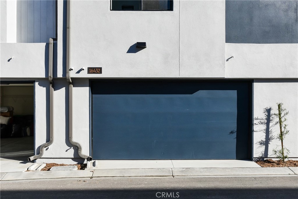 16432 Compass Avenue Tustin, CA 92782 - Photo 35 of 35 a view of a bathroom with a sink and a mirror