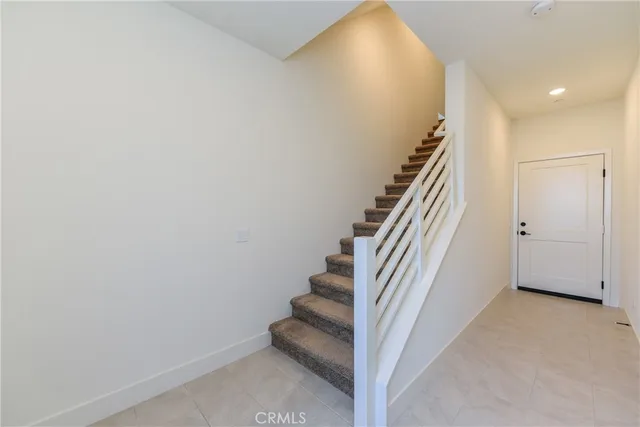 a view of entryway with stairs