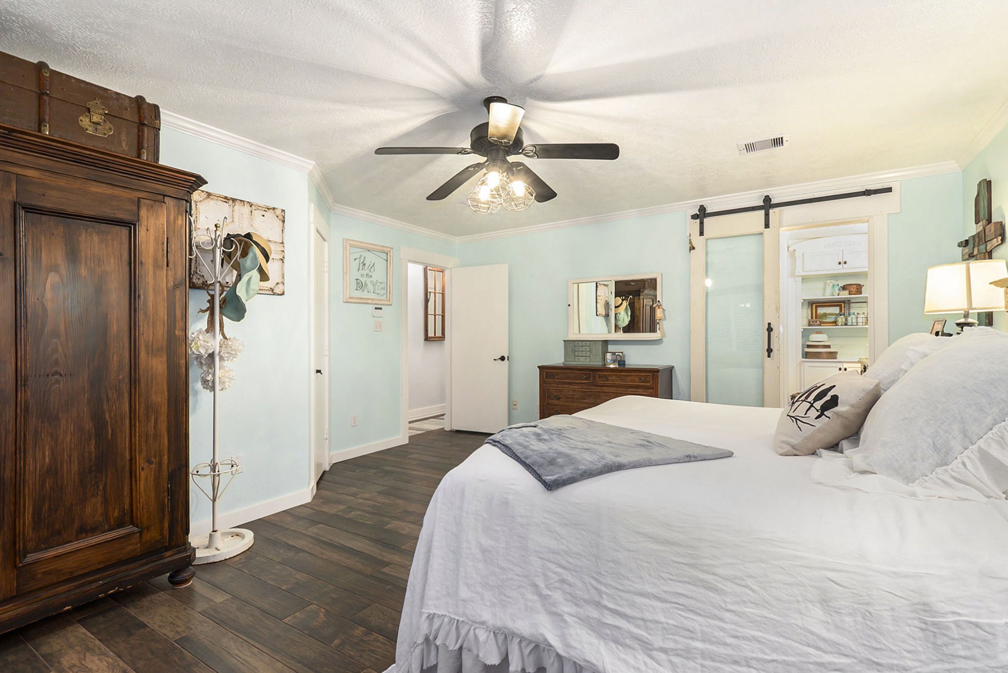 7363 County Line Road Willis, TX 77378 - Photo 26 of 34 Experience seamless comfort with this primary bedroom featuring an elegant view into the stylish bathroom.