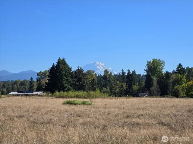 a view of mountain with a yard