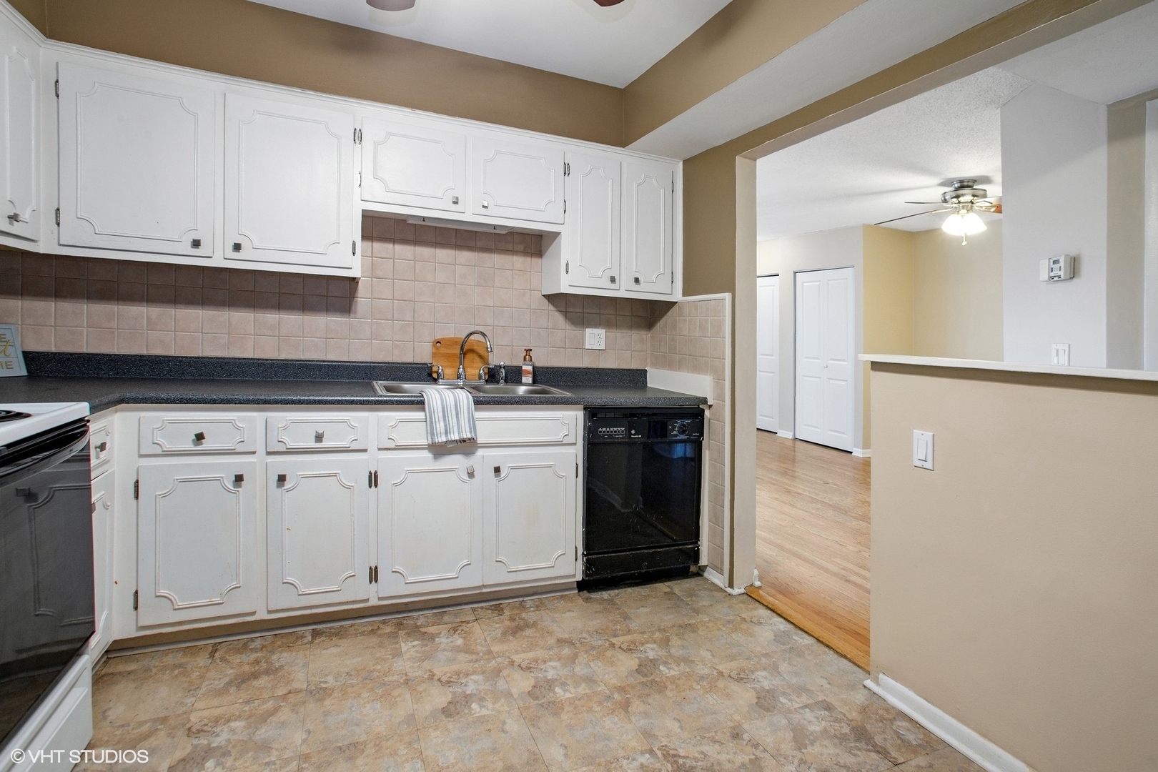 9624 West Higgins Road, Unit 3FN Rosemont, IL 60018 - Photo 5 of 12 a kitchen with white cabinets and white appliances