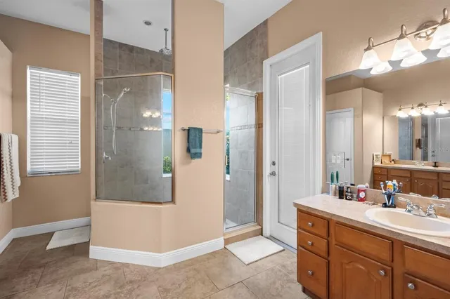 a en suite bathroom with a toilet a sink and a mirror