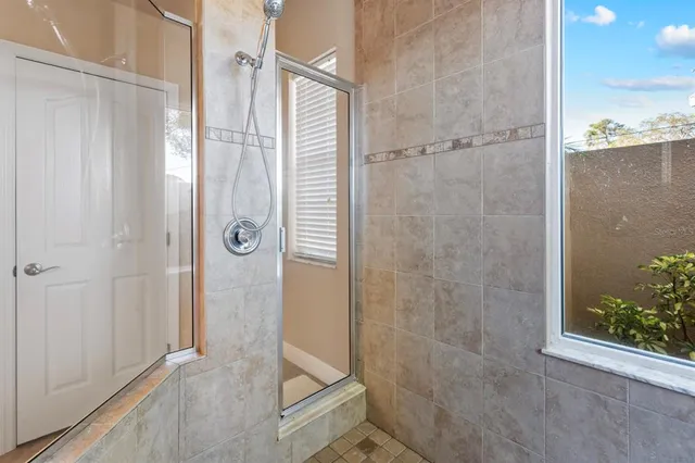 a kitchen with stainless steel appliances a sink dishwasher stove refrigerator and cabinets