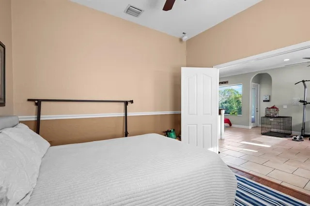 a bathroom with a granite countertop sink mirror vanity and toilet