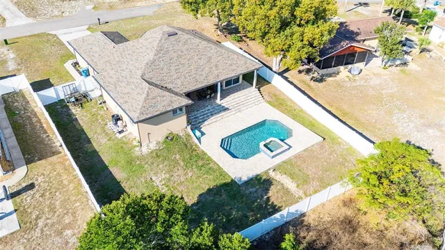 an aerial view of residential house with outdoor space
