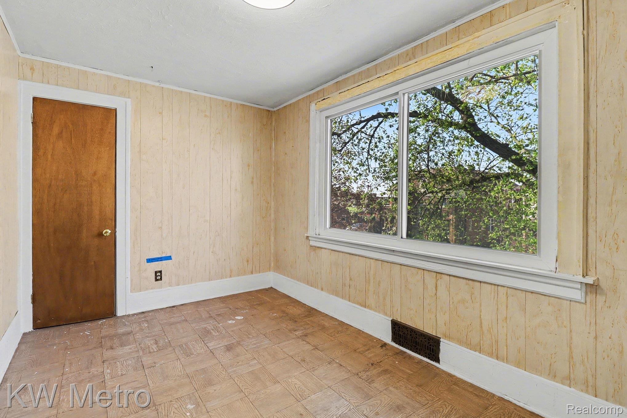 85 Walnut Street River Rouge, MI 48218 - Photo 13 of 20 Unfurnished room with wooden walls and parquet floors