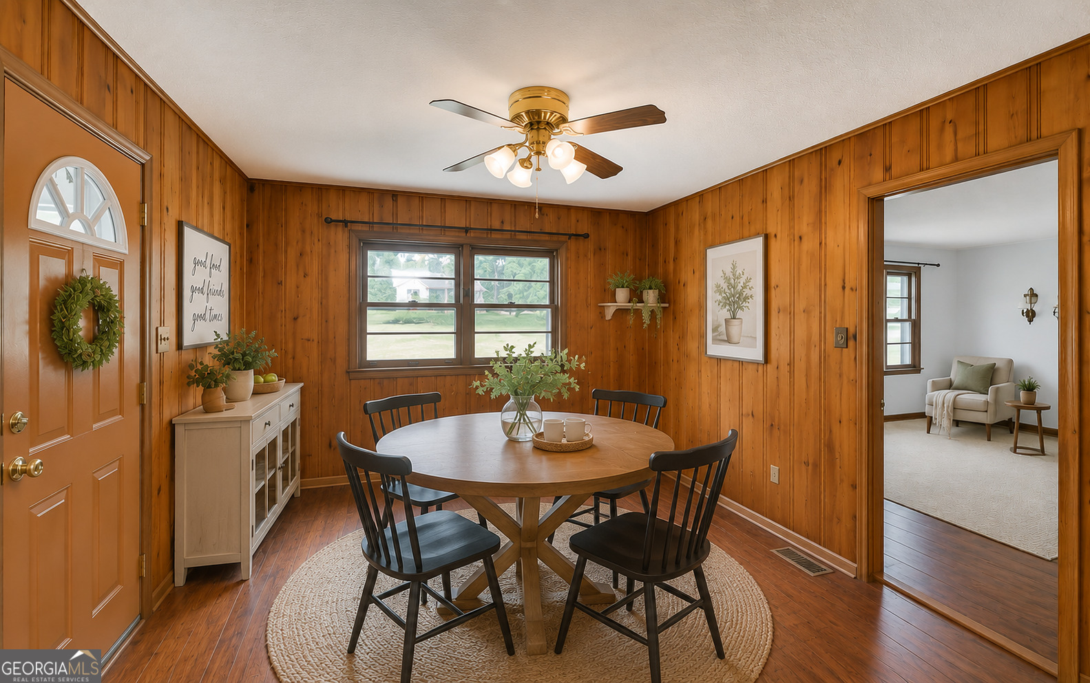 586 Collins Road Toccoa, GA 30577 - Photo 3 of 46 a dining room with furniture a chandelier and wooden floor