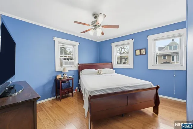 a bed room with a bed and a chandelier