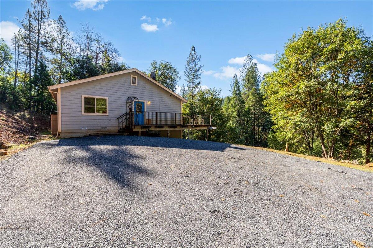 5875 Bear Creek Road Garden Valley, CA 95633 - Photo 1 of 1 a view of house with a yard and bushes