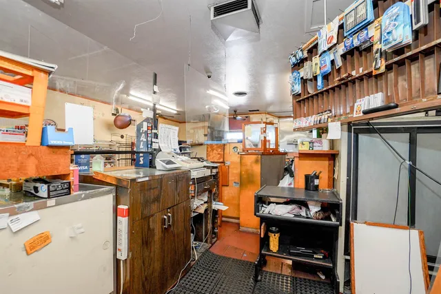 a living room with furniture a pool table and a large window