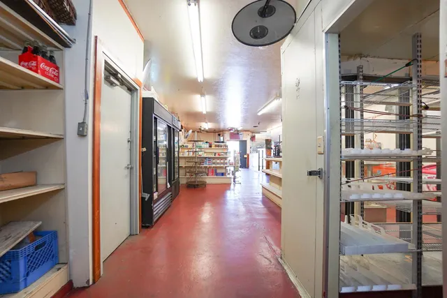 a view of a kitchen with lots of appliances